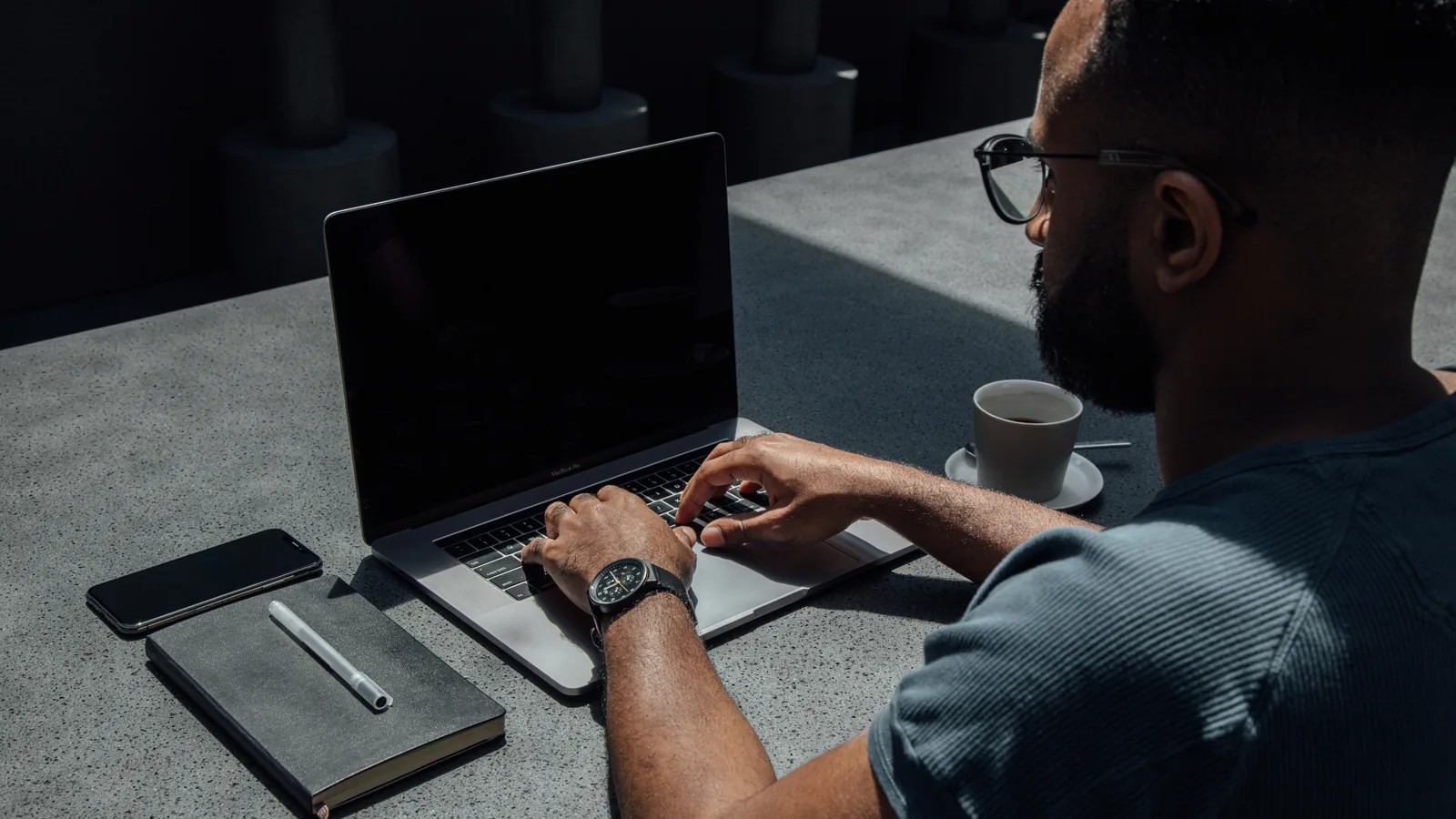 Person working on a laptop representing digital electronic invoicing in the UAE