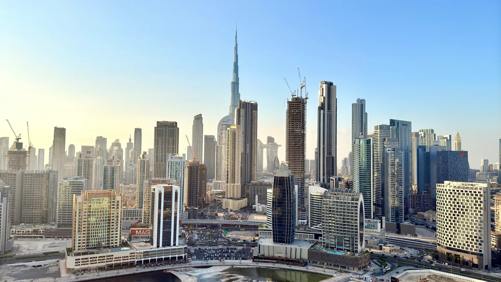 Dubai Business Bay waterfront skyline representing UAE free zone companies and QFZP status