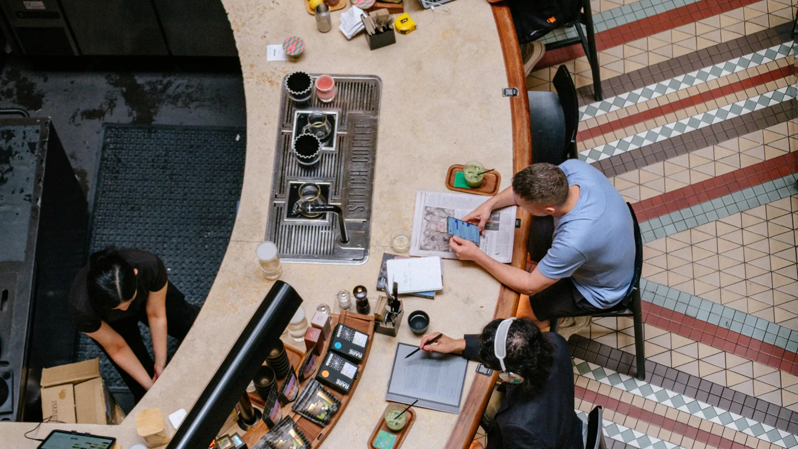 People working at a modern counter representing UAE SME accounting and bookkeeping choices