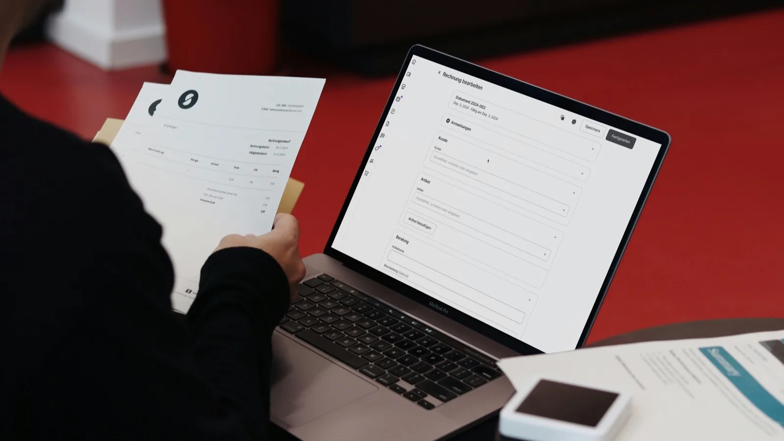 Desk with documents representing a UAE tax invoice