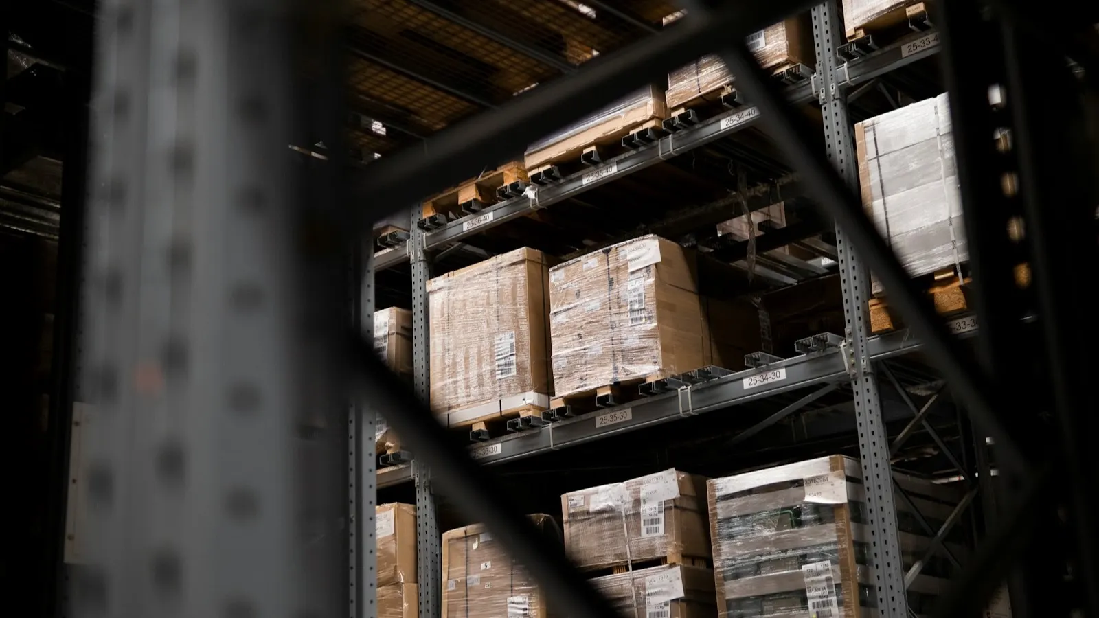 Warehouse shelves stacked with boxes and pallets, representing supplier checks before claiming UAE input VAT