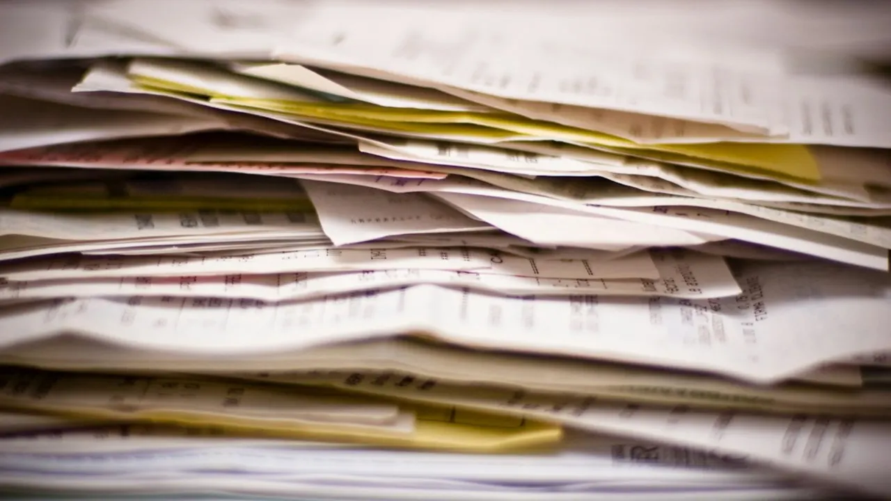 A thick pile of invoices and receipts, the paperwork an auditor asks to see A thick pile of invoices and receipts, the paperwork an auditor asks to see